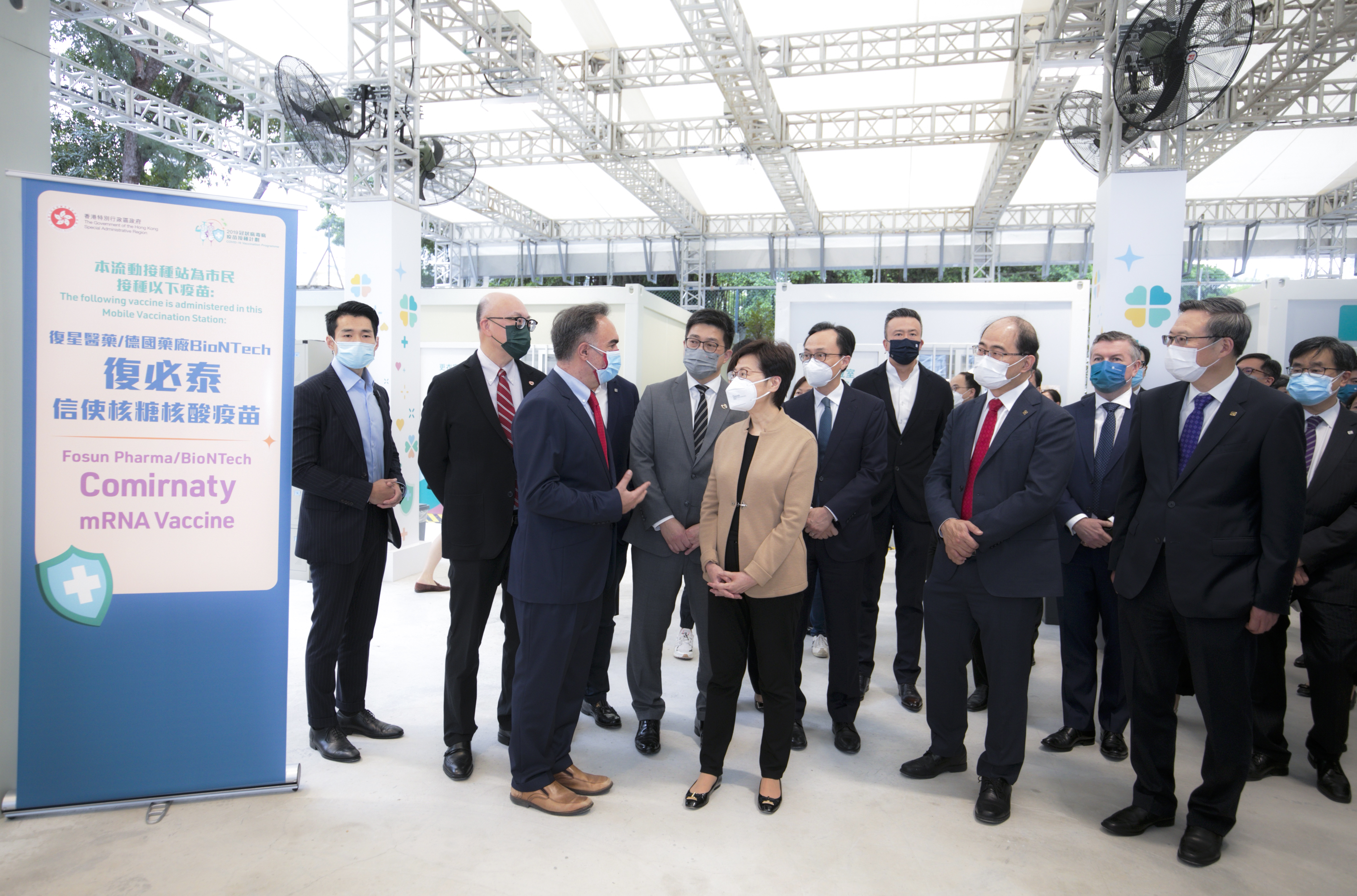 The Chief Executive Carrie Lam and Secretary for the Civil Service Patrick Nip visit the new pop-up Community Vaccination Centre at Caroline Hill Road site, jointly offered by Chinachem Group and Hysan Development, on the first day of its operation.